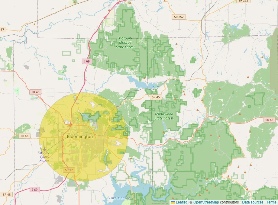 Map of the area around Bloomington, Indiana, with a yellow circle centered on the city and the state forests and small towns to the east left unshaded.