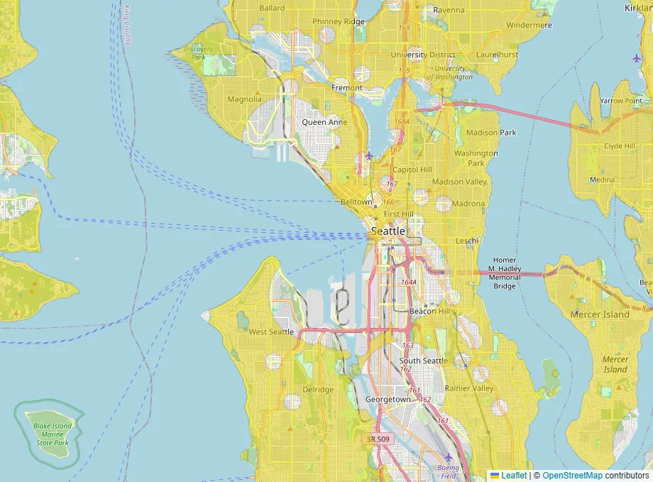 Map of Seattle with yellow shading over most neighborhoods, round gaps scattered through them, and the industrial land along the Duwamish Waterway left unshaded.